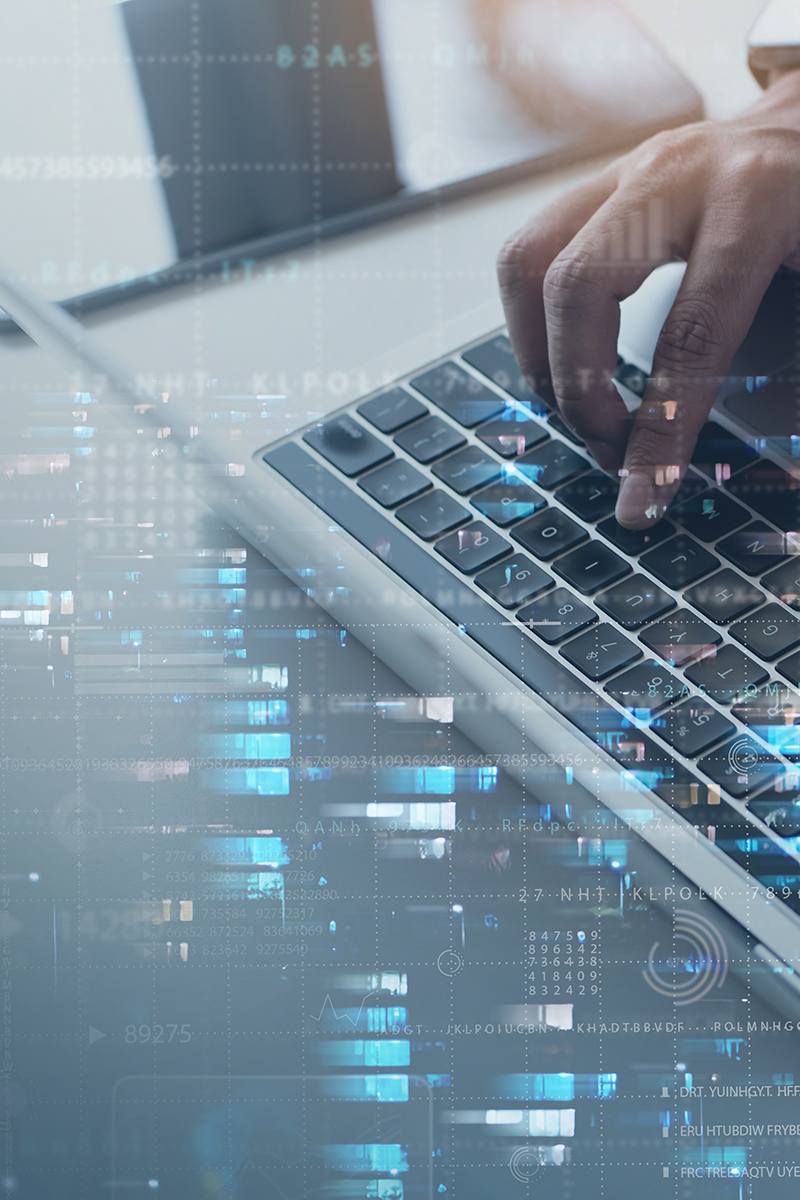 Computer engineer working on laptop computer with server room, data center, big data storage as backgrounds, digital technology, database, IT support, telecommunication, internet network technology