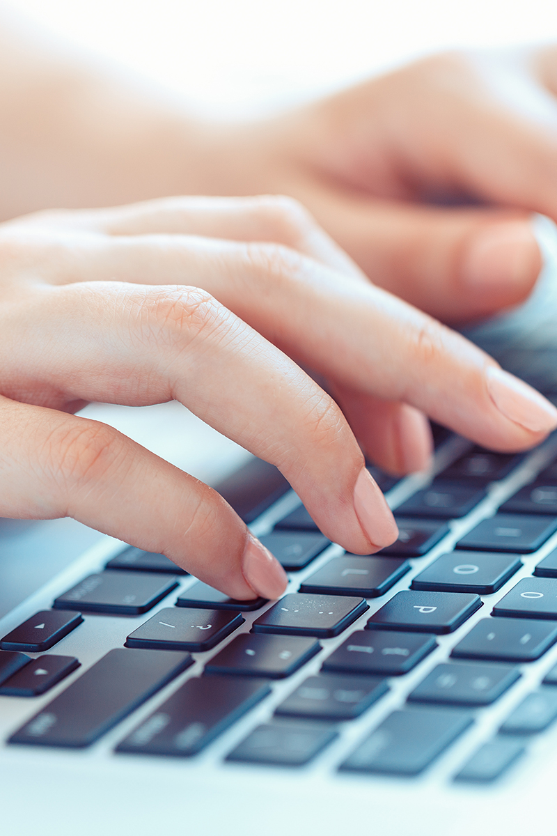 Female hands or woman office worker typing on the keyboard